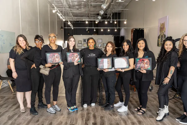 Connecticut lash license program graduate holding certificate at DFW Lash University
