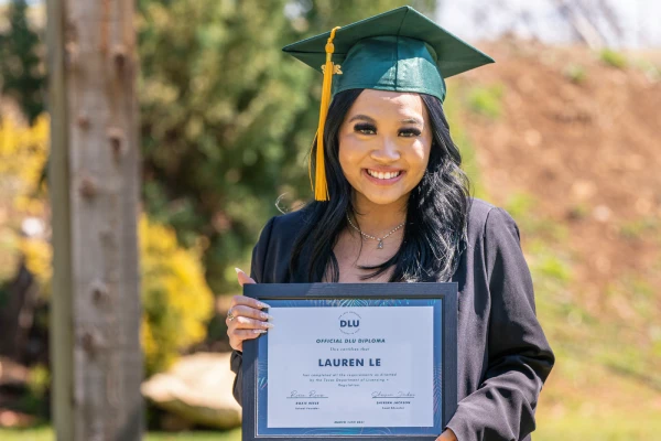 Connecticut lash license program student in cap and gown at DFW Lash University