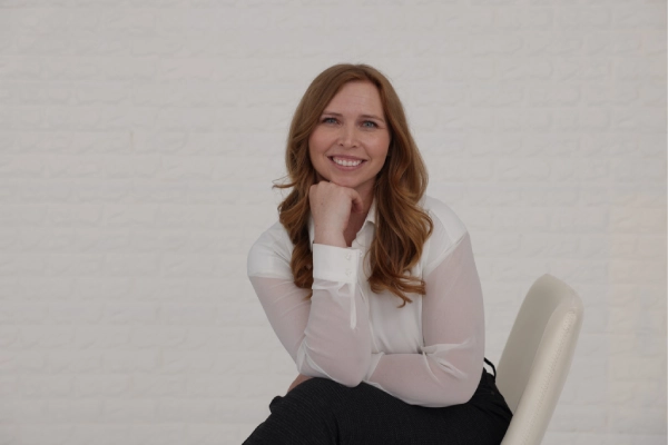 Connecticut lash license graduate showing framed certificate